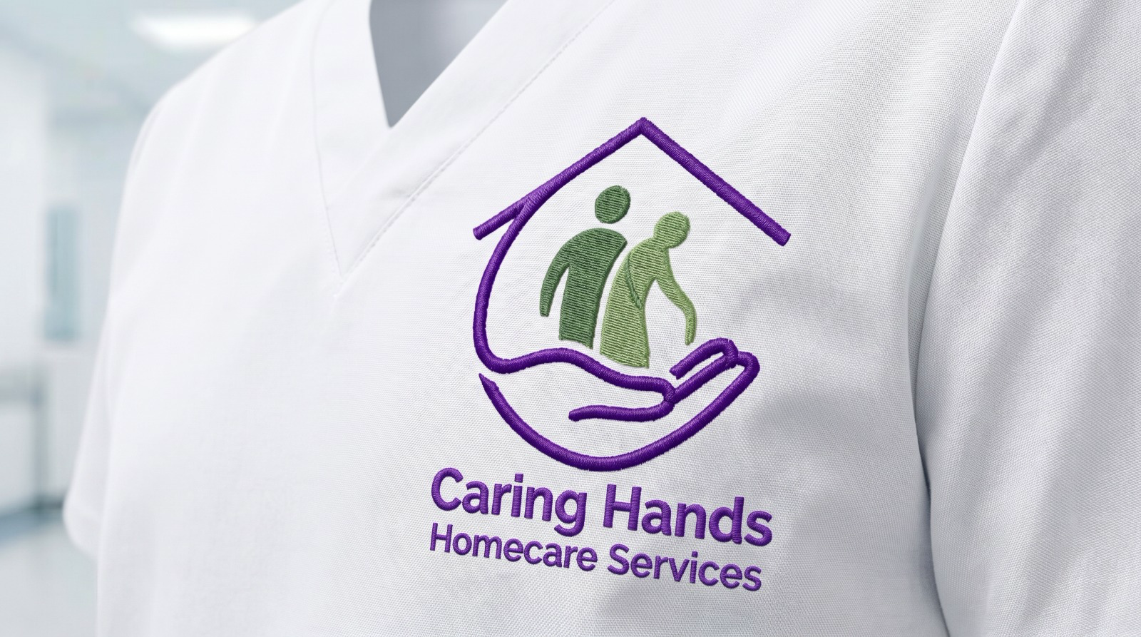 The new Caring Hands Homecare Services logo embroidered on a white care uniform